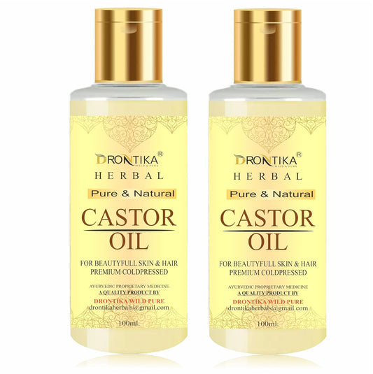 Two bottles of Drontika Herbal Castor Oil on a white background