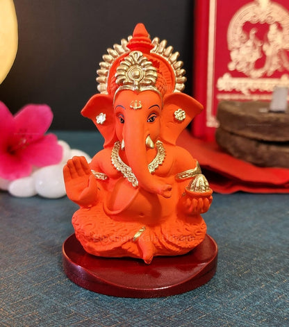 Handcrafted Poly Resin Ganesha Statue with Base - Perfect for Car Dashboard, Office Desk, Shelves, and Home Decor - Ideal Housewarming Gift! (OrangeMukutwithbase)