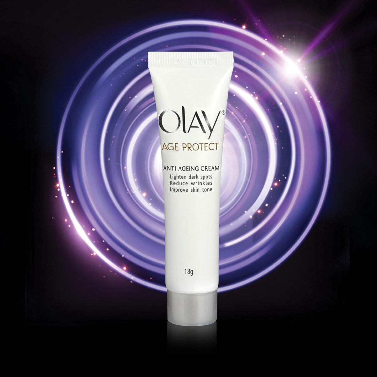 Olay Age Protect anti-aging cream tube on a dark background with a glowing effect