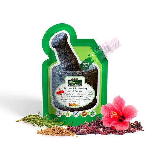 Green packaging of a herbal product with hibiscus and rosemary, featuring a pink flower and dried herbs on a white background.