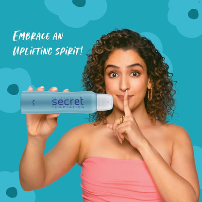Woman holding a Secret Temptation product with a blue background and text 'Embrace an Uplifting Spirit'.