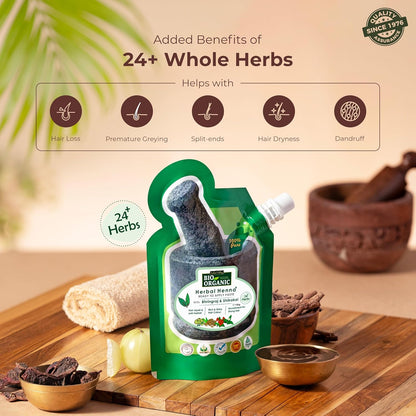 Herbal hair product packaging with added benefits on a wooden surface