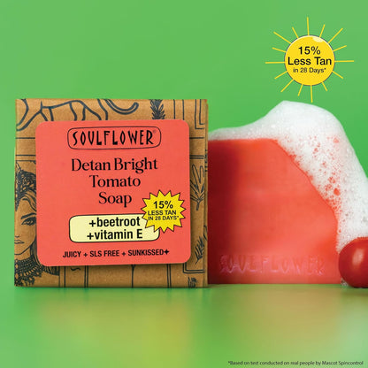 Soulflower Detan Bright Tomato Soap with packaging on a green background