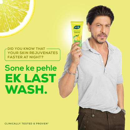 Man holding a tube of JOY product with lemon graphic and text on a yellow background