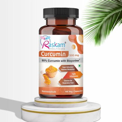 Bottle of Raskam Curcumin supplement on a white background with a palm leaf.