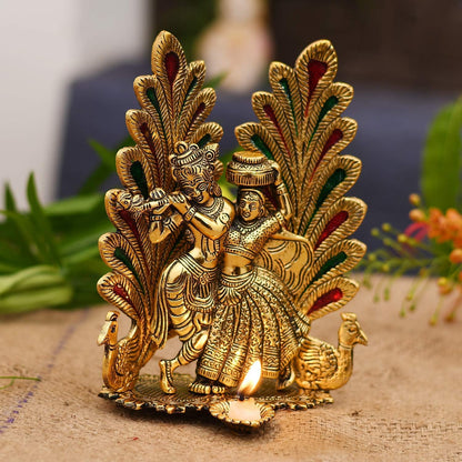 Collectible India Peacock Design Radha Krishna Idol Showpiece with Diya for Puja and Home Decor (7 x 5 Inches), Metal, Gold (1 Piece)