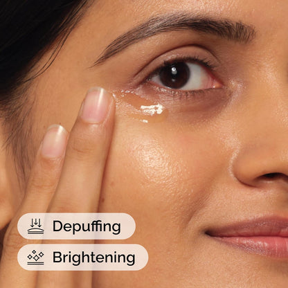 Close-up of a woman applying cream under her eye with text 'Depuffing' and 'Brightening'.