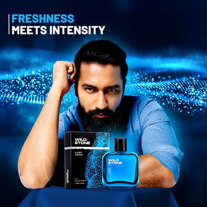 Man holding Wild Stone perfume bottles with a blue and black background