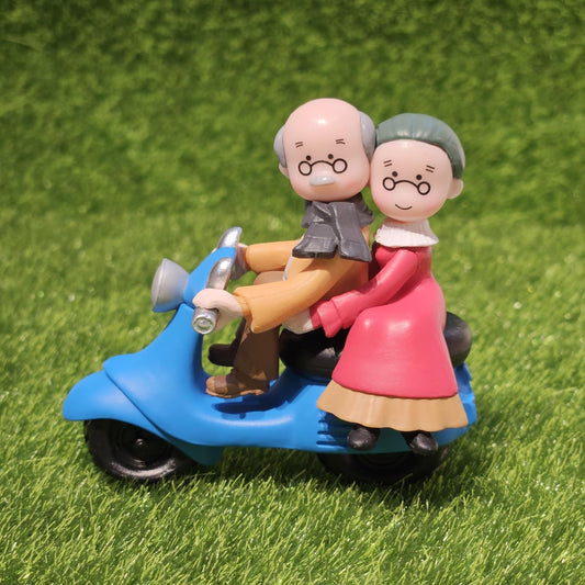 Vintage Decorative Miniature Couple on Scooter Figurine, PVC Garden Ornament, Romantic Home Decor Collection Piece