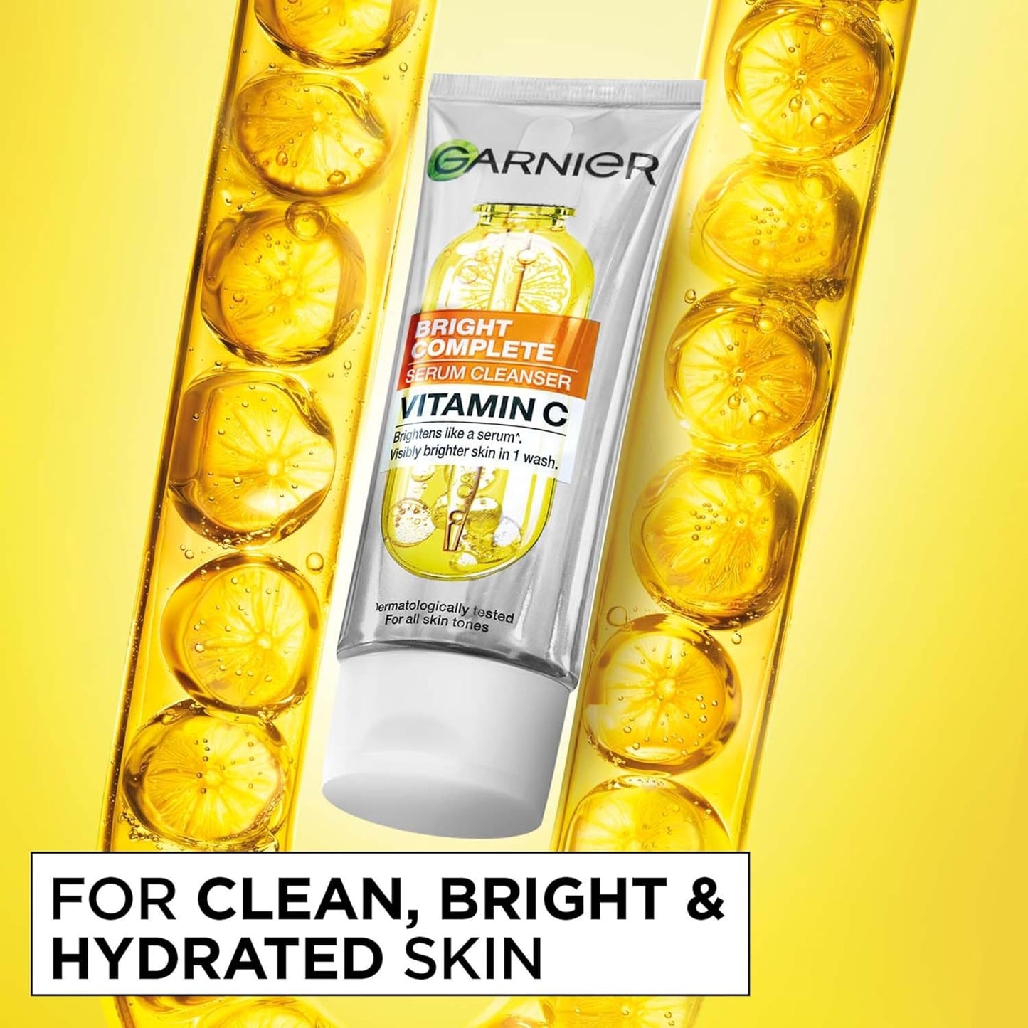 Garnier Bright Complete serum cleanser with lemon slices on a yellow background