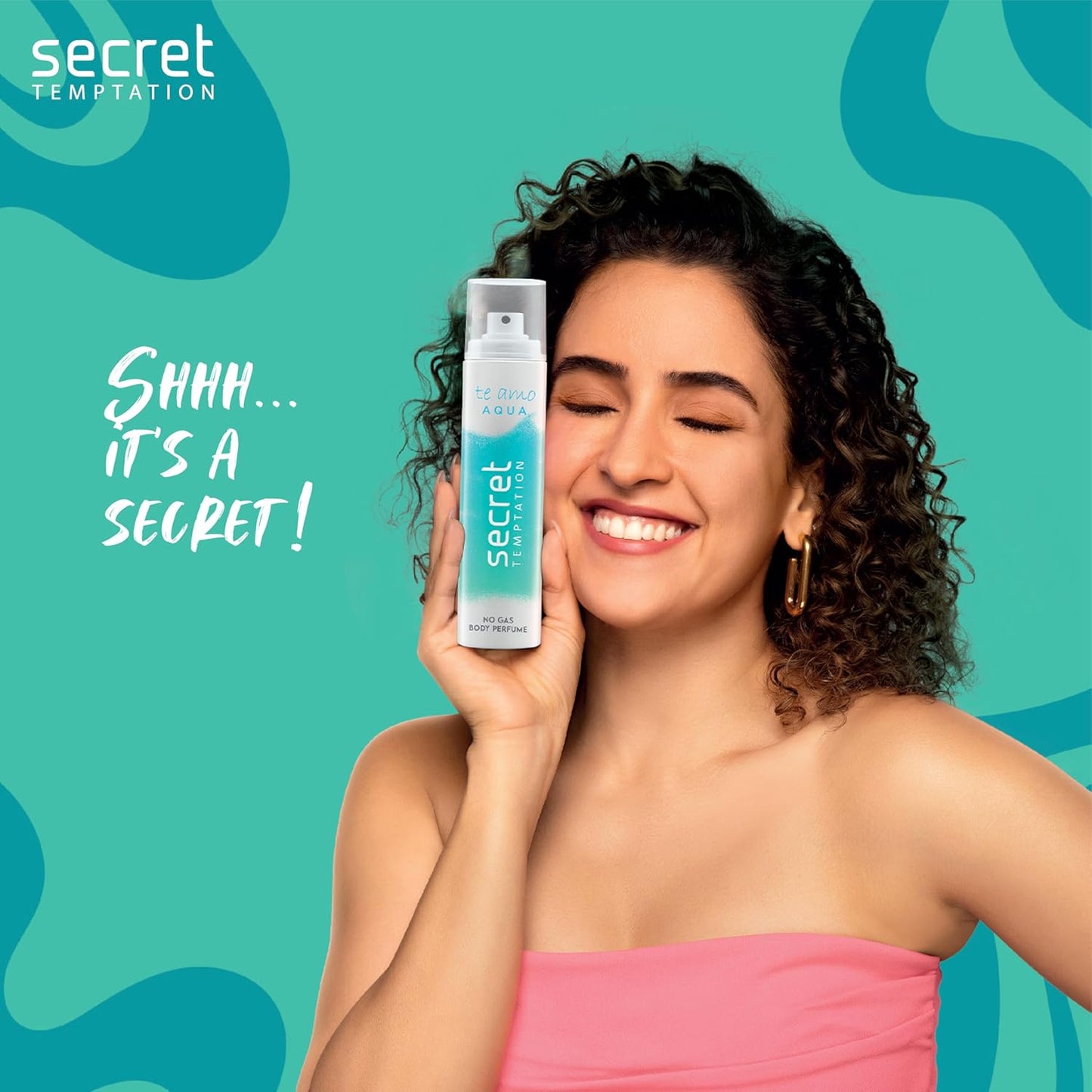 Woman holding a Secret deodorant can against a teal background with 'Secret Temptation' branding.