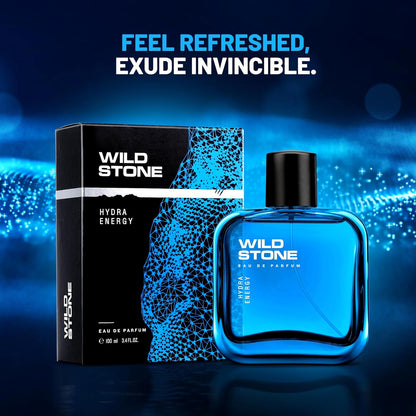 Wild Stone perfume bottle and packaging on a blue gradient background with text 'Feel Refreshed, Exude Invincible'.