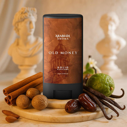 Solid perfume bottle labeled 'Old Money' by Arabian Aroma with spices and fruits on a wooden board.