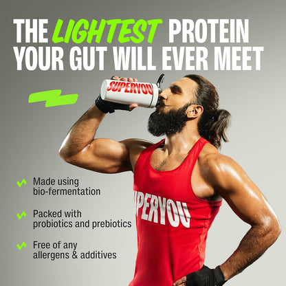 Man in red 'SuperYou' tank top drinking from a white container with green text on a gray background.