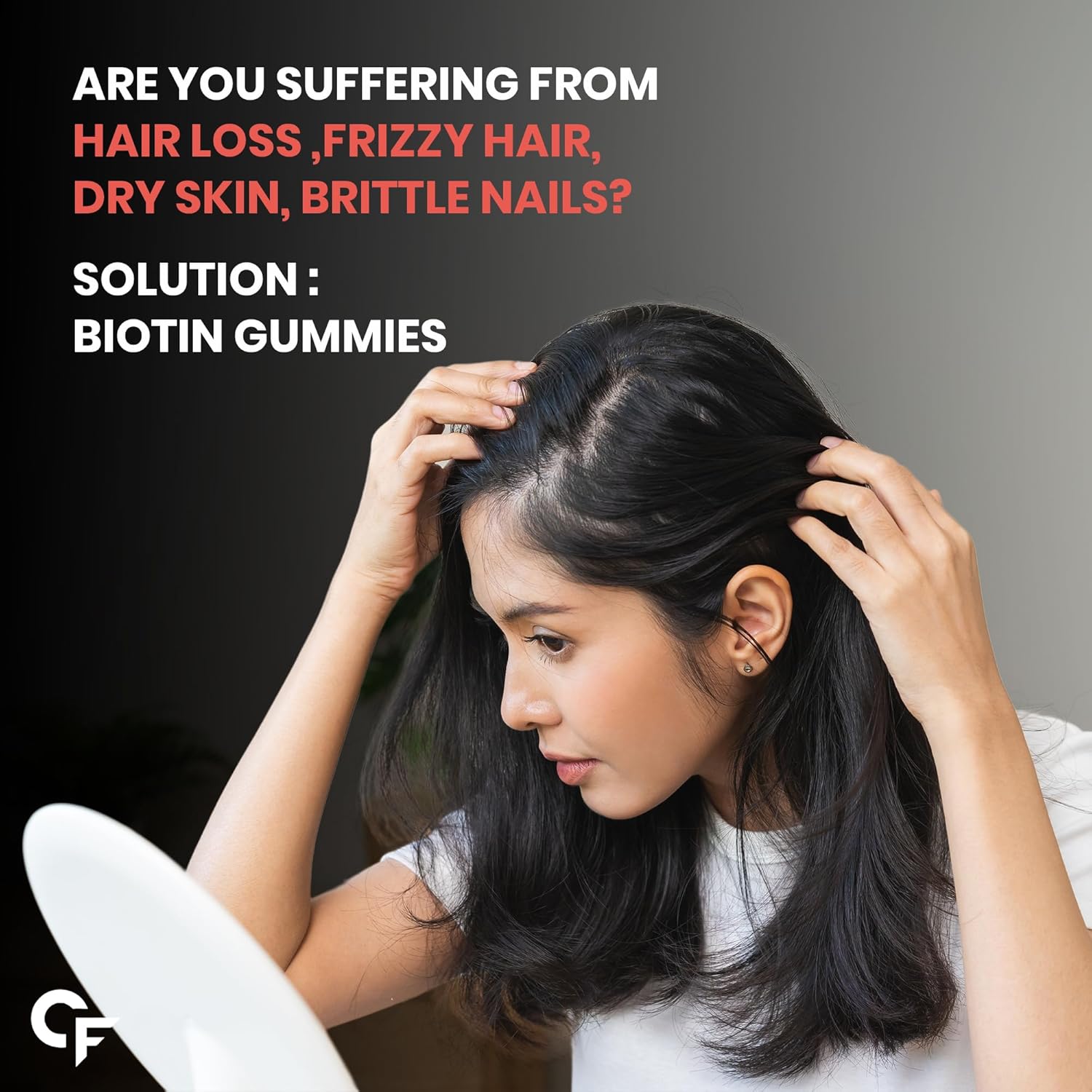Woman with hair issues looking at herself in the mirror, with text about biotin gummies as a solution.