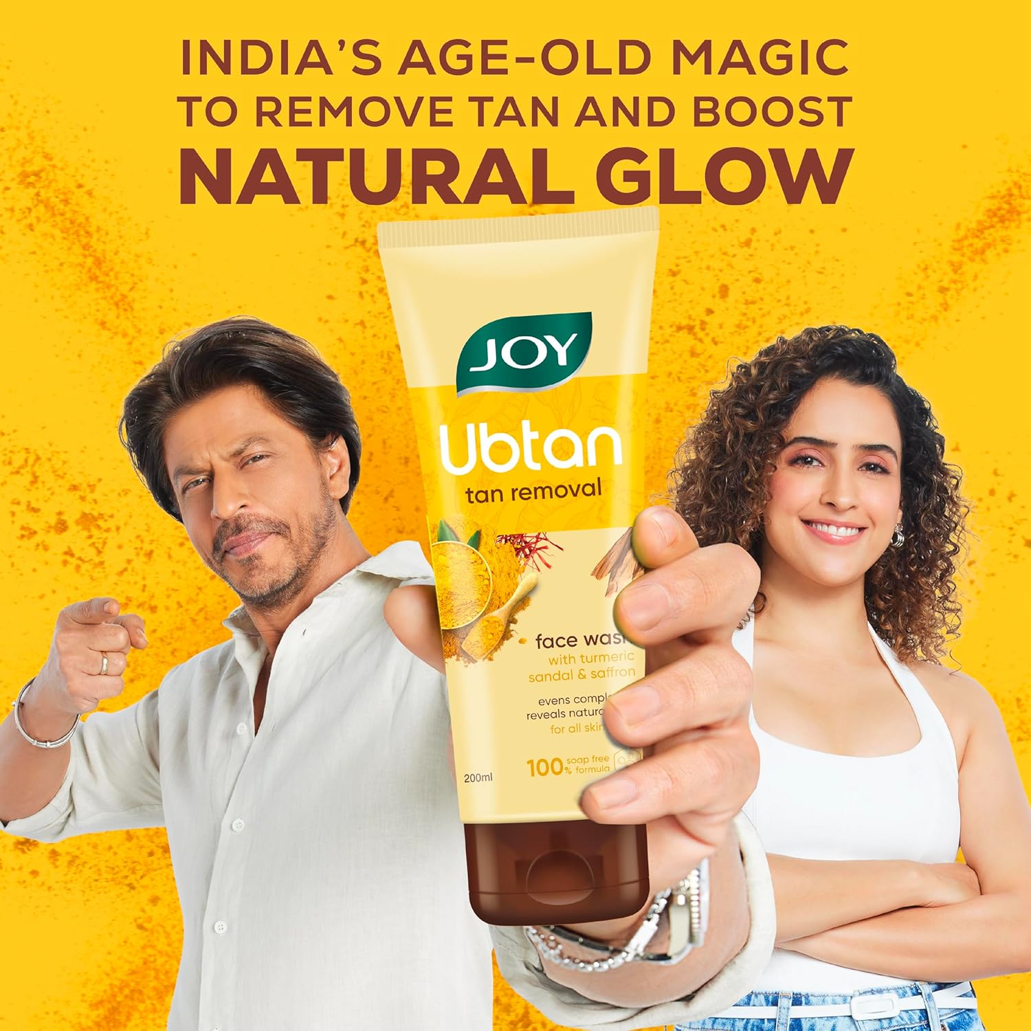 Two people holding a Ubtan tan removal product with text on a yellow background