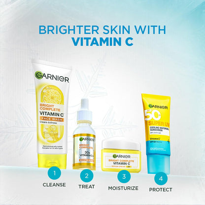Garnier skincare products with vitamin C on a gradient blue background