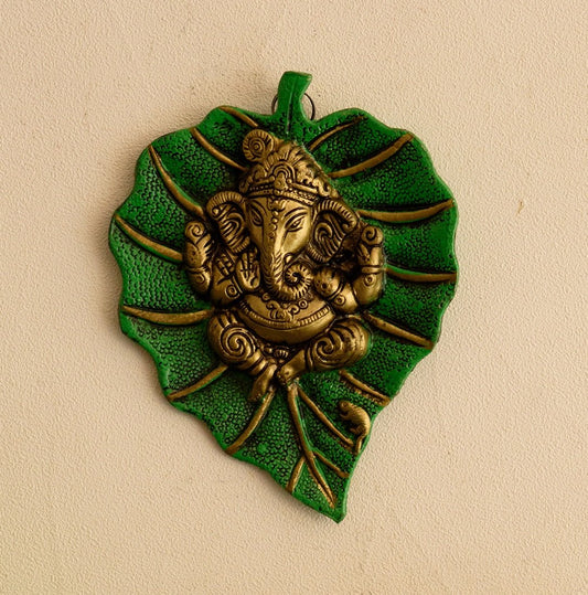 Metal Golden Lord Ganesha Idol On Green Leaf Ganesha Wall Hanging Decorative Showpiece for Wall Decor-Diwali Decoration Items for Home Decor-Gift for Diwali Ganesh Chaturthi Housewarming.