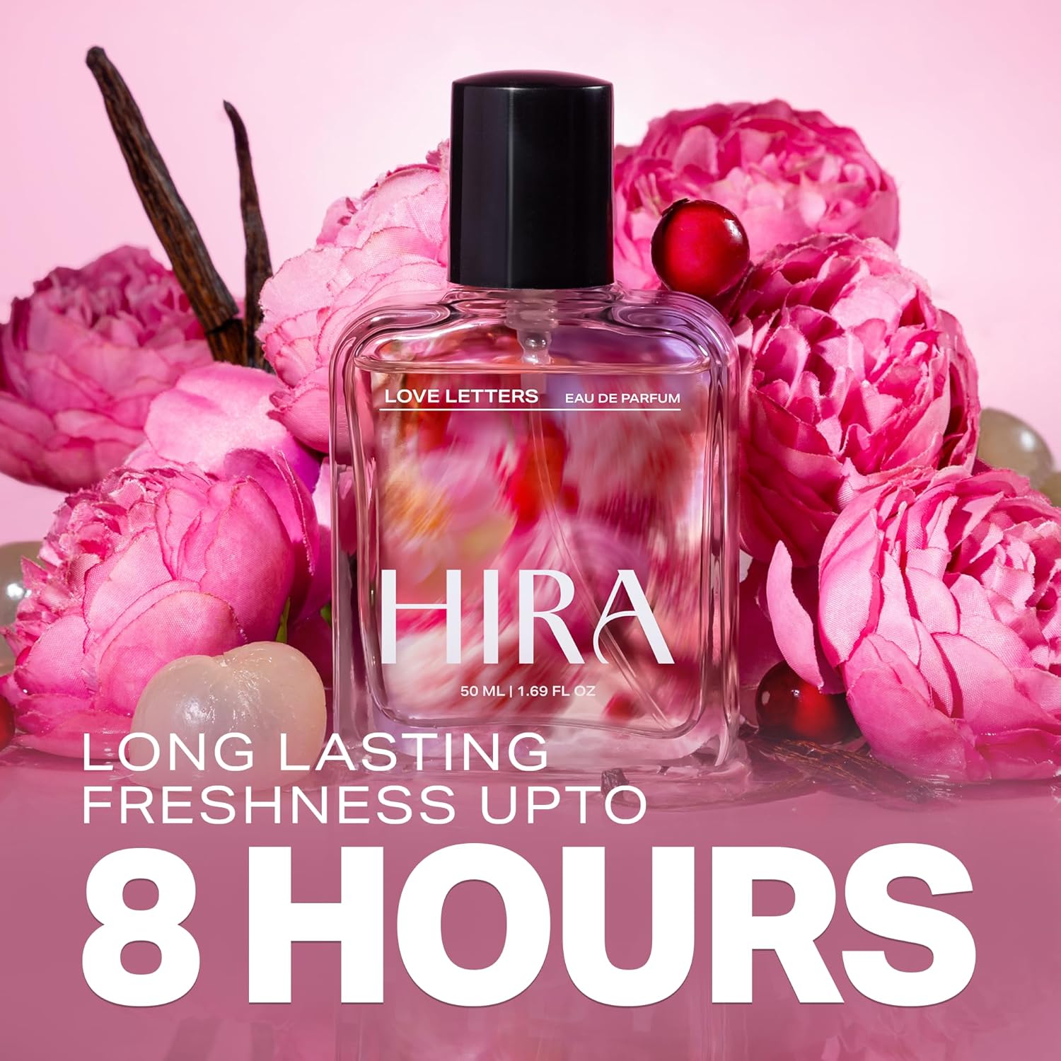 HIRA perfume bottle surrounded by pink flowers on a pink background