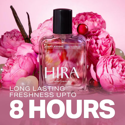 HIRA perfume bottle surrounded by pink flowers on a pink background