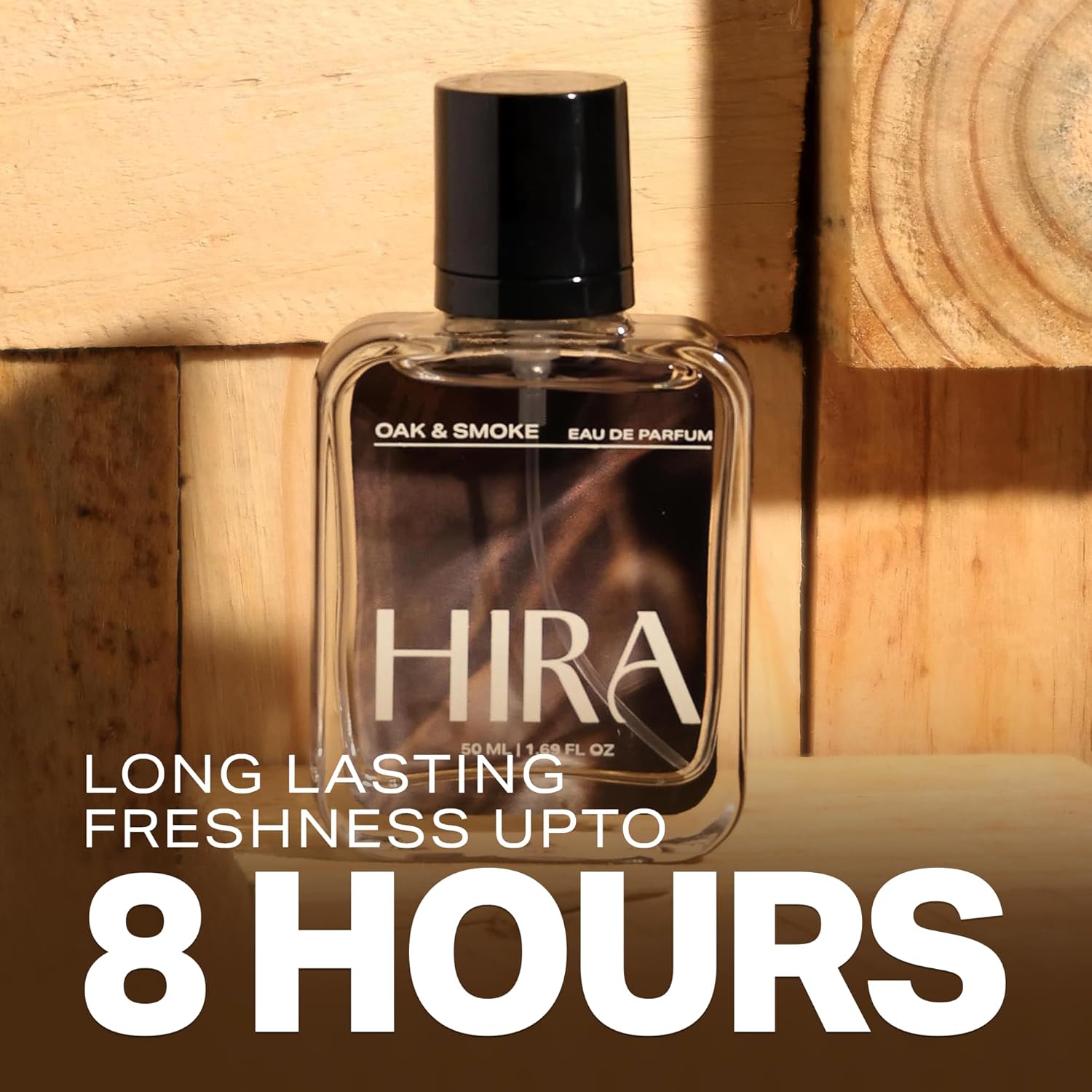 HIRA Oak & Smoke Eau de Parfum bottle on a wooden background with text about longevity.