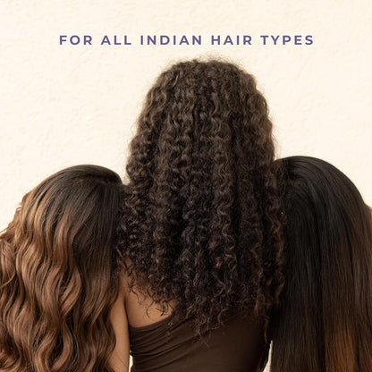 Three women with different hair types standing close together against a beige background.