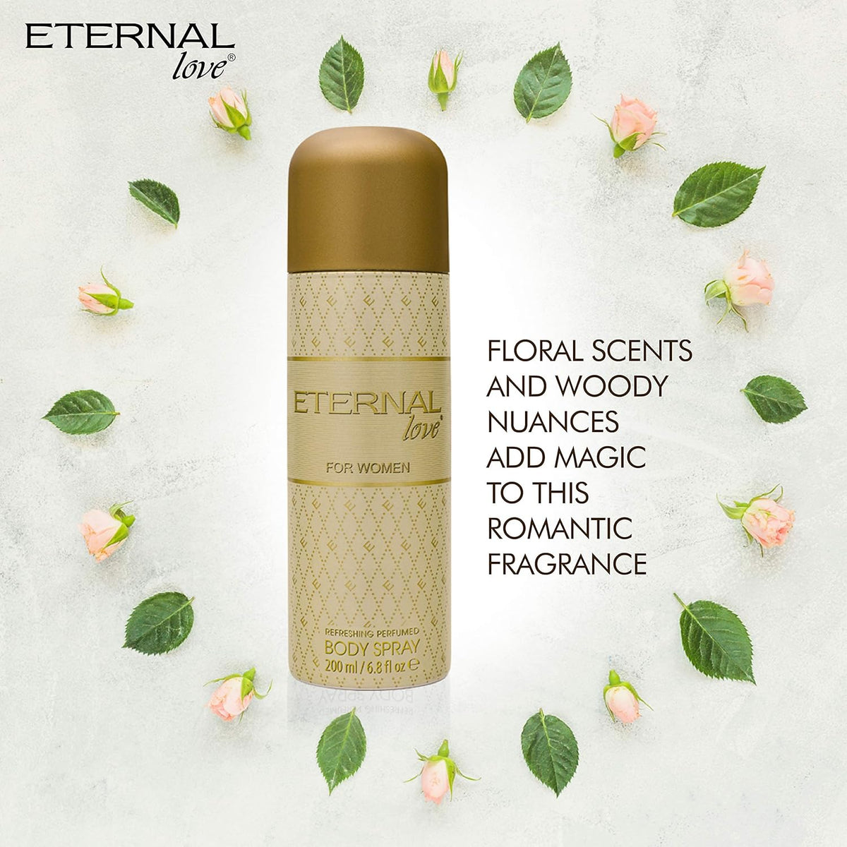 Body spray bottle labeled 'Eternal Love' surrounded by flowers and leaves on a light background