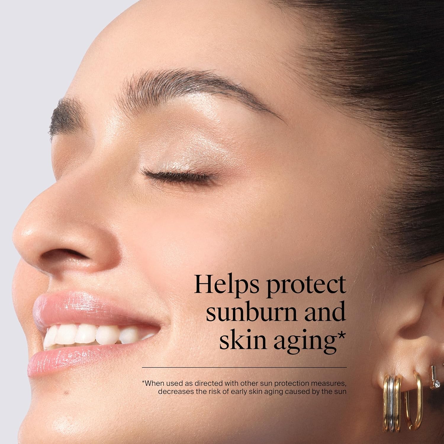 Close-up of a woman's face with text about sunburn and skin aging protection.
