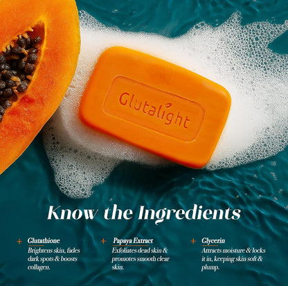 Orange soap bar with 'Glutalight' branding on a blue and white background with a papaya and text about ingredients.
