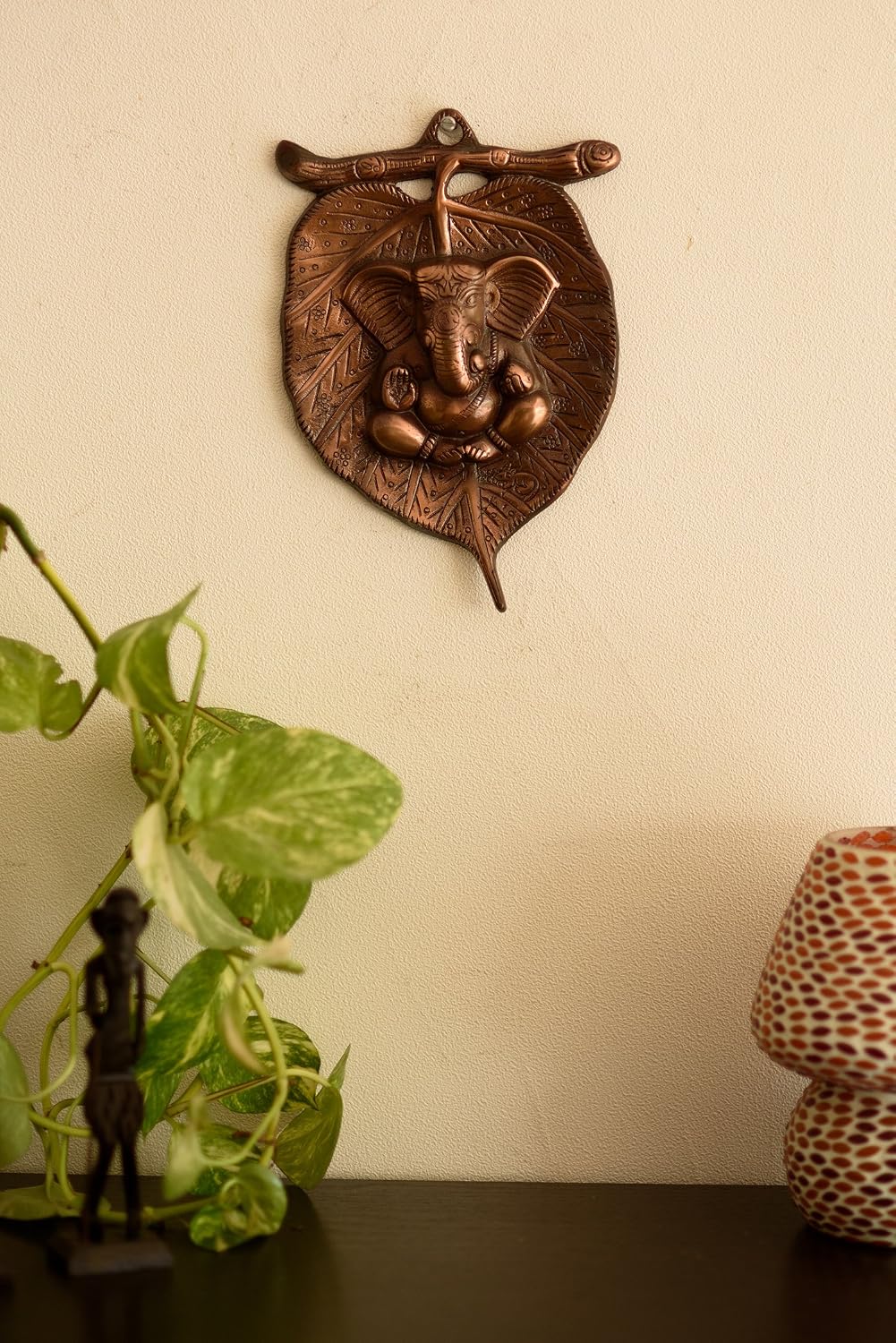 eCraftIndia Lord Ganesha on Leaf Wall Hanging (13.75 cm x 1.25 cm x 21.25 cm, Brown)