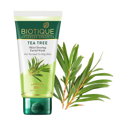 Biotique Tea Tree Skin Clearing Facial Wash with tea tree leaves on a white background