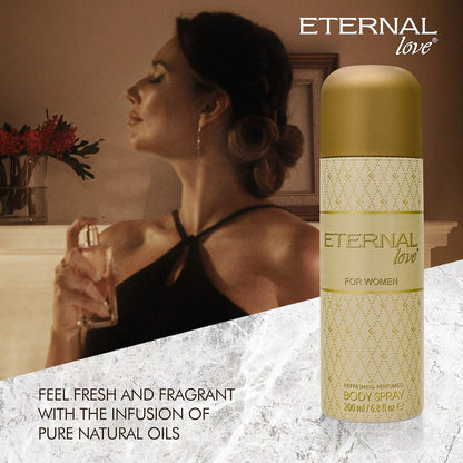 Woman holding a glass with a bottle of 'Eternal Love' body spray on a textured surface.