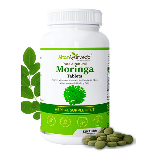 Bottle of Attar Ayurveda Moringa tablets with green leaves on a white background