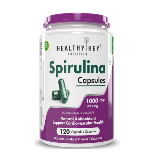 Container of Healthy Hey Nutrition Spirulina Capsules on a white background