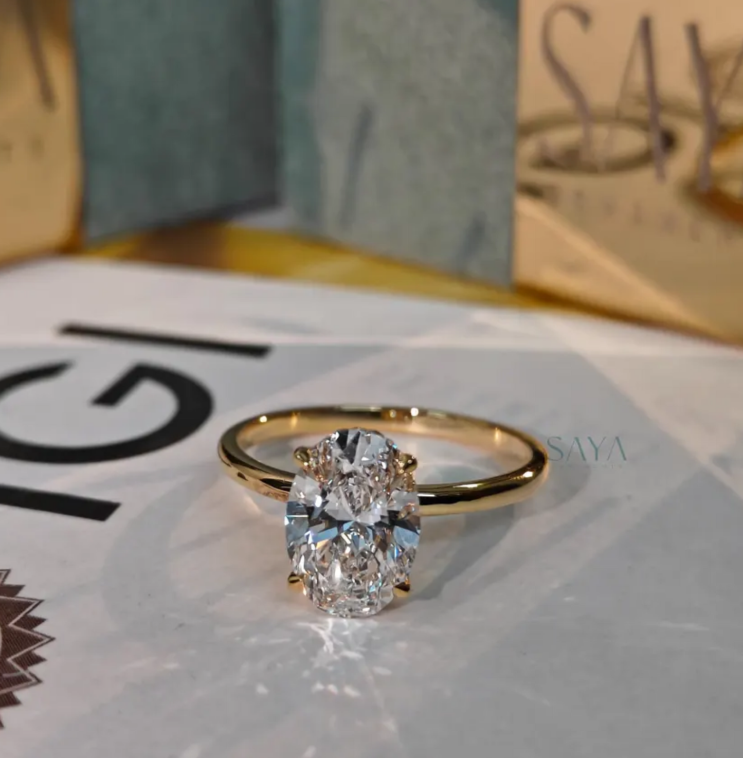 Gold ring with a diamond on a magazine page