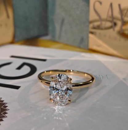 Gold ring with a diamond on a magazine page