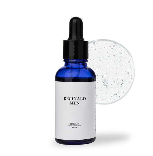 Bottle of Reginald Men skincare product with dropper on a white background