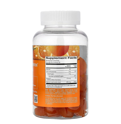 Supplement bottle with orange gummy bears and label on a white background