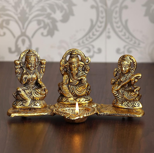 Golden Metal Handcrafted Lakshmi Ganesha Saraswati Idols with Diya On Leaf Chowki - Auspicious Decorative Idols & Diyas for Puja Room, Home, Office, Temple - Gift for Diwali, Housewarming