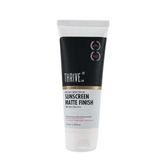 Thrive sunscreen tube with black and white packaging on a white background