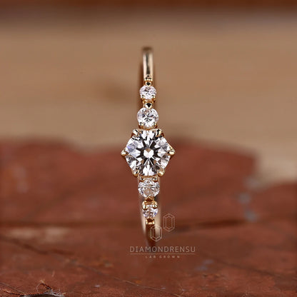 Gold ring with diamonds on a brown surface