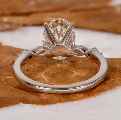 Silver ring with a diamond on a brown leaf