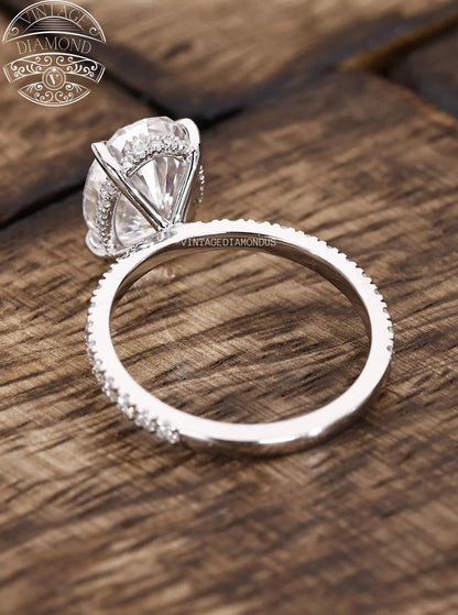 Diamond ring on a wooden surface with 'Vintage Diamond' branding.