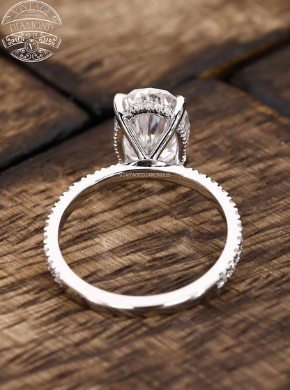 Silver diamond ring on a wooden surface with 'Lancaster Diamond' logo.