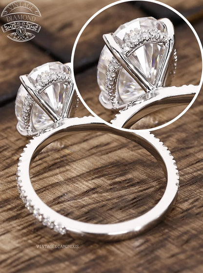 Silver ring with diamond-like stone on a wooden surface, featuring 'Vintagediamonds' branding.