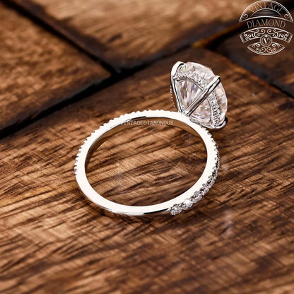 Diamond ring with a unique diamond design on a wooden surface, featuring the Vintage Diamond logo.