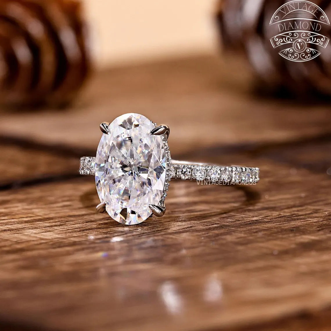 Diamond ring on a wooden surface with 'Vintage Diamond' branding.