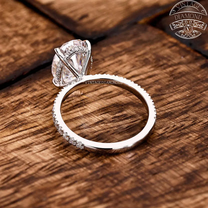 Diamond ring on a wooden surface with 'Vintage Diamond' branding.
