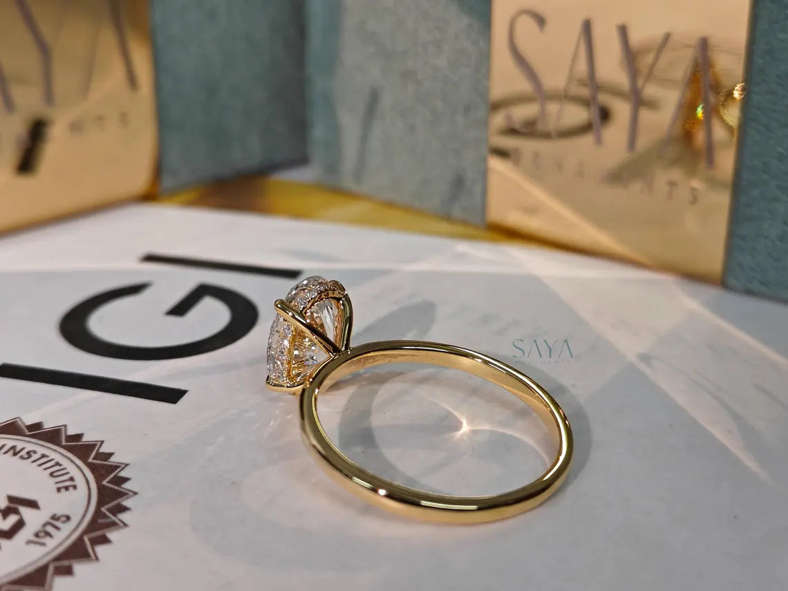 Gold ring with a diamond on a magazine page