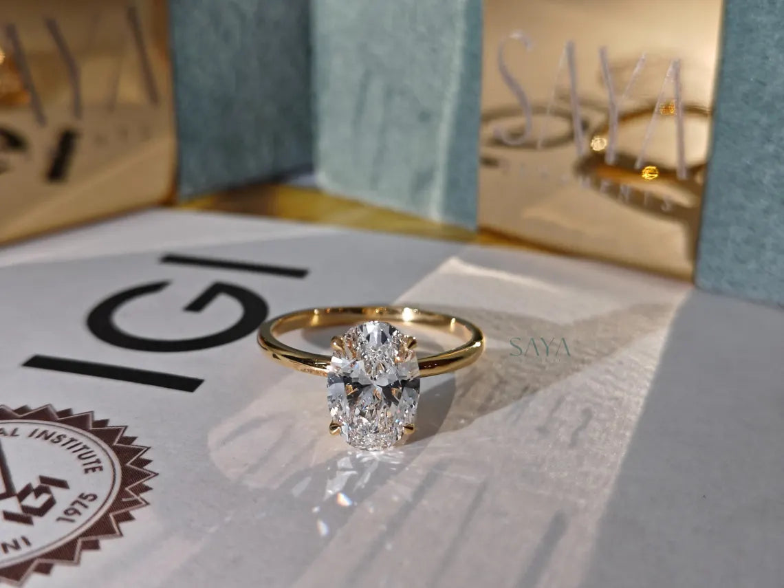 Diamond ring on a surface with 'IGI' branding in the background